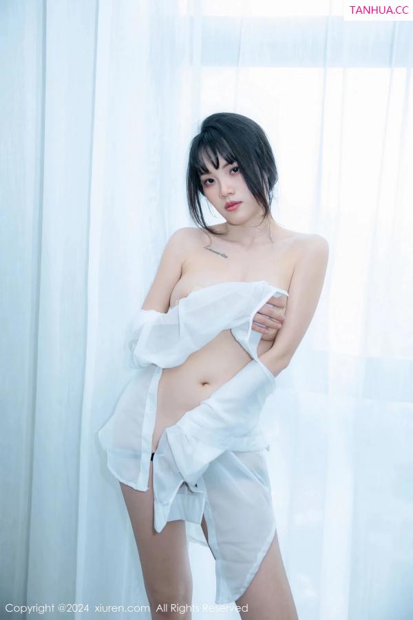   [XiuRen]高清写真图 2024.04.01 No.8320 唐安诺 黑丝美腿第23张图片